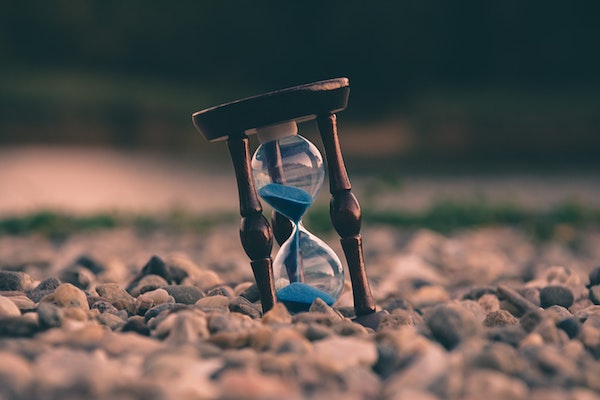 image of hourglass with sand halfway to the bottom